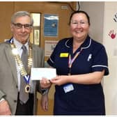 Warwick Probus Club No. 2 Chairman Brian Perkins presenting Mary Ward manager Sara Houghton with a cheque. Photo supplied