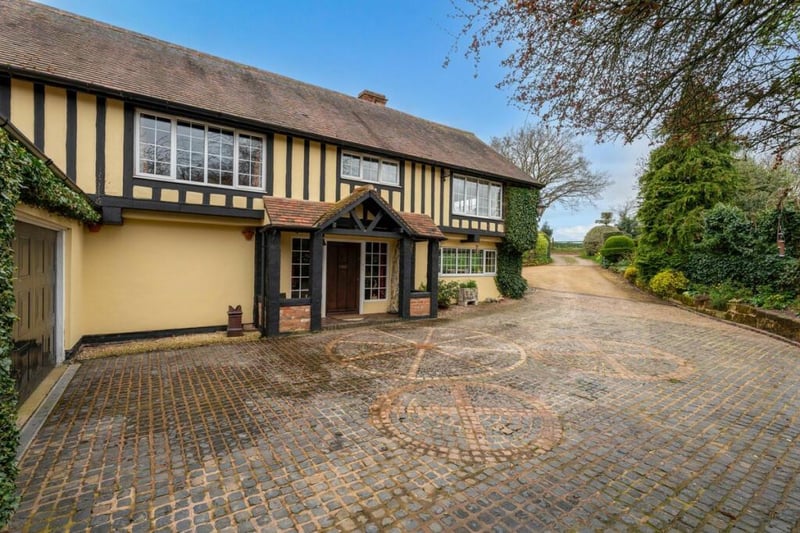 The Tudor style home is a 16th century cottage that has been blended with recent extensions in the same style