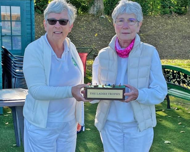 Chair, Lynne Breedon,left, presents the Trophy to Pauline Dennis.