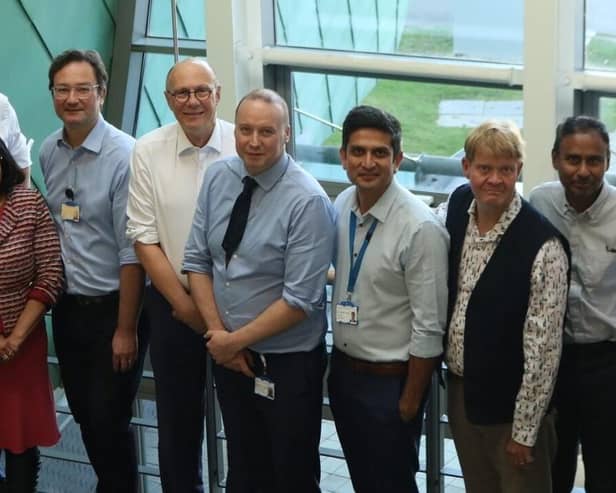 Professor Sir Stephen Powis (sixth from left) during the visit to University Hospital, Coventry
