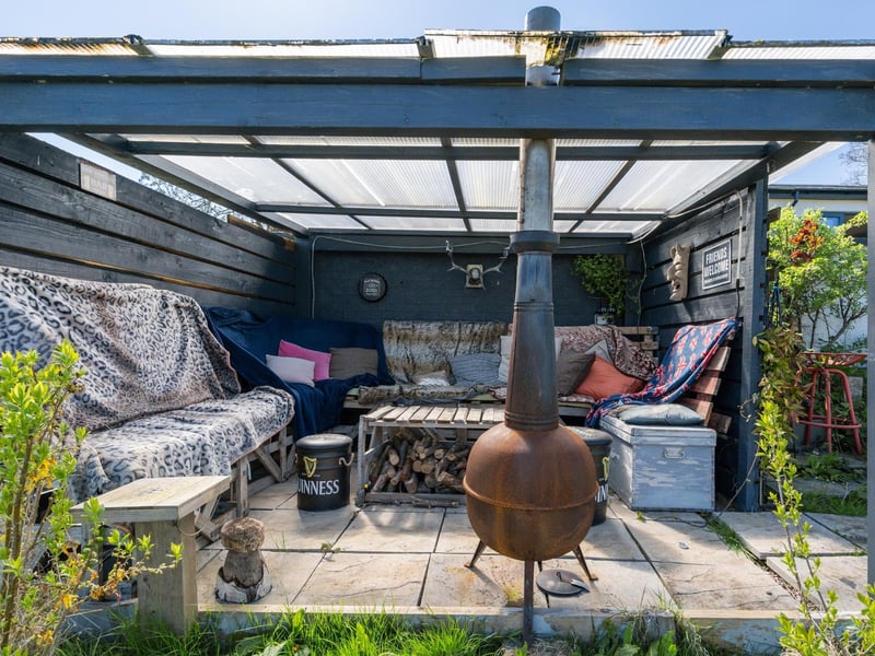 A lounging area in the garden. Photo by DM & Co. Homes