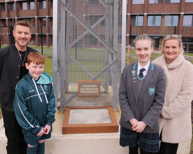 Free Radio Breakfast Show hosts JD and Roisin unveil their Hollywood-style handprints at Houlton School, with Jacob (aged 11) and Maizie (aged 12).
