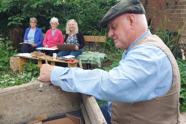 Alan Purser posing as a wheelwright with an old cart