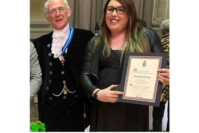 Alex Pearson, community champion at Morrisons in Leamington, with the High Sheriff of Warwickshire David Kelham. Photo supplied