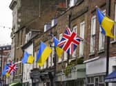 Ukrainian flags are flown from properties in Church Street, Twickenham in southwest London, following Russia's invasion of Ukraine. Picture date: Wednesday March 2, 2022.
