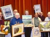 Artists show off their work.