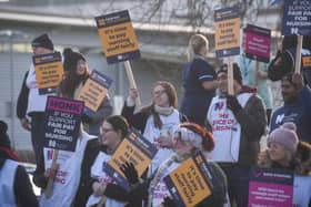 A Royal College of Nursing picket line as staff strike outside a hospital.