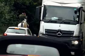 Members of the Warwickshire Hunt have been filmed causing traffic disruption on a high crash risk section of the busy Fosse Way in Warwickshire. This rider was on his phone as traffic queued behind him.