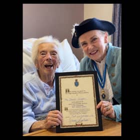 Janet Cooper receiving the award from the High Sheriff of Warwickshire Susan Rasmussen. Picture supplied.