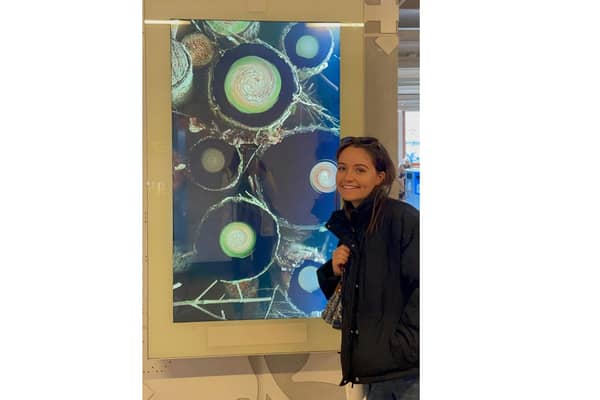 Katie Jones with her artwork on display at the DEMO (Design in Motion) Festival. Picture supplied.