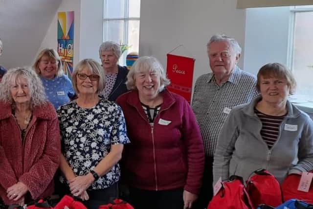 Volunteers put the Buddy Bags together.