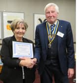 Sue Melville being presented her award by Warwick Rotary president Alan Bailey. Photo supplied