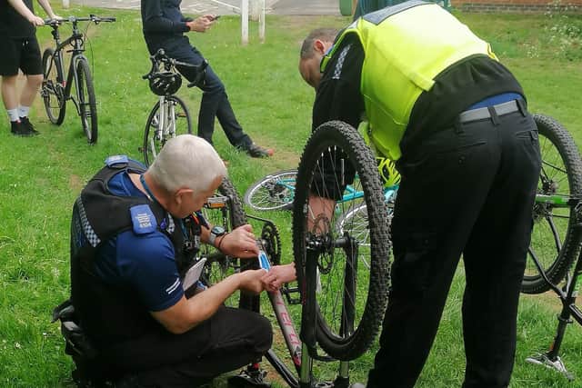 Officers from Warwickshire Police's Whitnash Safer Neighbourhood Team put free security coding on bikes at the event.