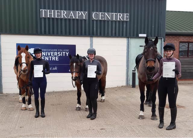 Photo caption: from left to right, the successful student cohort of Rachel Courts, Grace Debruyne, and Ellie Rowe with their certificates at the equestrian centre of Moreton Morrell College. Photo supplied