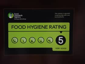 A Food Standards Agency rating sticker on a window of a restaurant in central London. A huge variation in food hygiene standards remains across the UK, with one in five high or medium-risk food outlets failing to meet standards, according to a study.