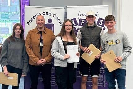 Iain Green, Headteacher at Rugby Free School, with some of the students who have received their A-levels. Photo supplied by Rugby Free School