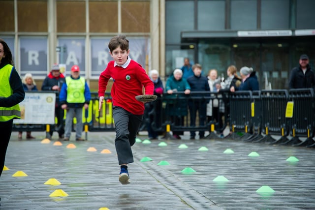 Warwick town centre hosted the annual 'Pancake Race' this week. Children from seven primary schools took part in 26 teams. Photo by Mike Baker
