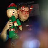 Ricky Evans got the Ally Pally crowd in the festive spirit with his walk-on