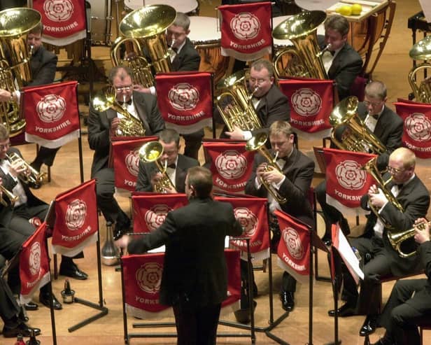 A member of the audience watches as the Grimethorpe Colliery Band perform at the Yorkshire Regional Championships part of the National Brass Band Championships of Great Britain at St George's Hall in Bradford.