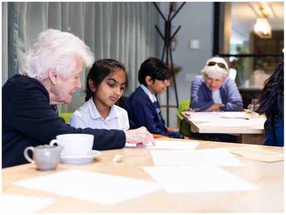 Year 4 pupils Rita and Rohini working with residents from the Austin Heath retirement village. Photo supplied