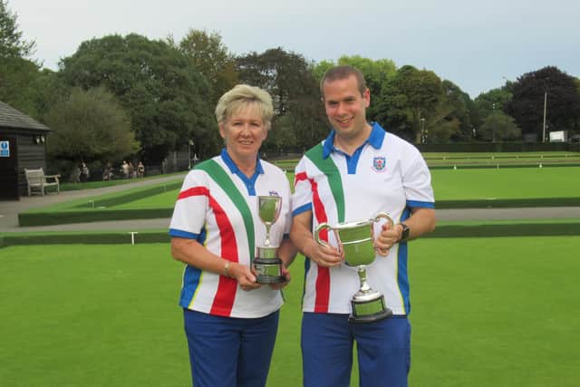 2023 Ladies’ and Men’s Singles Champions, Anita Cowdrill (left) and Graham White (right), with their trophies.