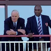 David Owen watching a game from the clubhouse balcony, with former player Eddie Saunders in 2009   (Archive picture by Mike Baker)