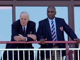 David Owen watching a game from the clubhouse balcony, with former player Eddie Saunders in 2009   (Archive picture by Mike Baker)