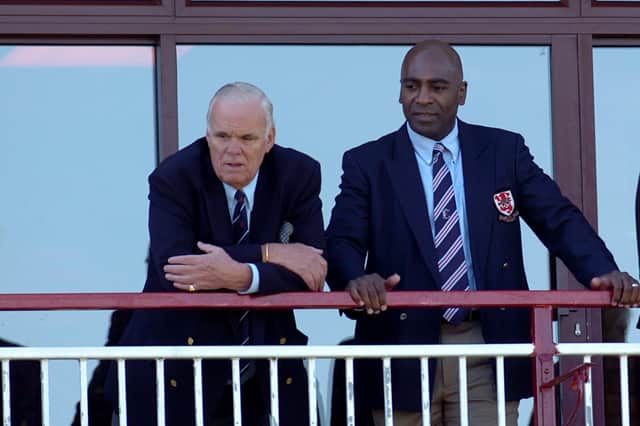 David Owen watching a game from the clubhouse balcony, with former player Eddie Saunders in 2009 (Archive picture by Mike Baker)