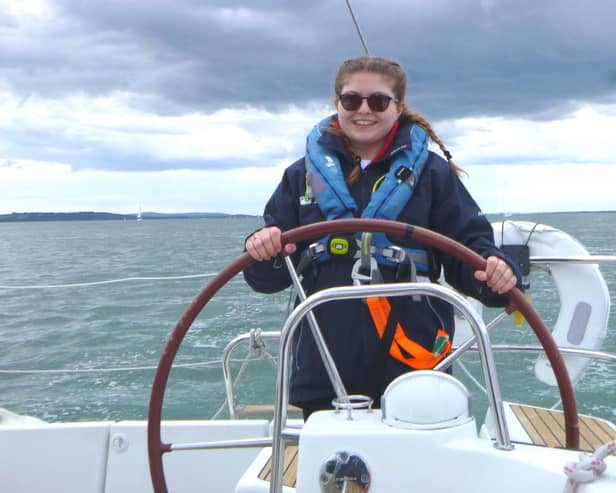 Libby at the helm.