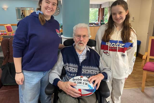 Resident Richard Herridge and granddaughters, Caitlin and Ella Morgan, from the Old Laurentians Dragonesses Rugby Team