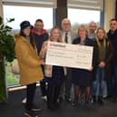 Sean Clarke, OurJay Foundation ambassador, Jem Issitt, Naomi Rees-Issitt, Cllr Derek Poole, Lorraine Marley, Rugby Borough Council’s bereavement services manager, Cllr Simon Ward, OurJay Foundation trustee Tracey Brand and Cllr Mike Hallam attended the cheque presentation at Rainsbrook Crematorium.
