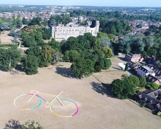 Positioned in Warwick Castle Farm Park field,  the bike’s frame was made from 252 straw bales, each measuring 81 x 46 x 31 cm and weighing 18 kg, with its wheels built from brightly coloured material to match the Commonwealth Games Colours. Photo supplied by Warwickshire County Council