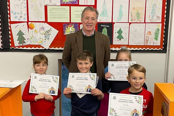 Valeria Wilkinson (L), Stanley Vernon (C), Amelia Dunphey and Tudor Negoia (R) with Mark Pawsey MP at Rugby Library