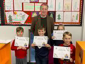 Valeria Wilkinson (L), Stanley Vernon (C), Amelia Dunphey and Tudor Negoia (R) with Mark Pawsey MP at Rugby Library