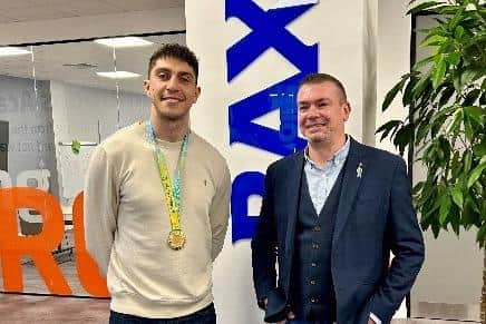 Leamington boxing hero Lewis Williams with Baxi director Paul Haynes. Picture suppliued.