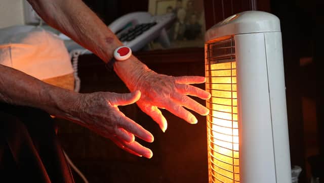File photo dated of a 19/11/14 of an elderly lady with her electric fire on at home in Liverpool. A "significant humanitarian crisis with millions of children's development blighted" is on the way if the Government does not act to prevent more than half of UK households plunging into fuel poverty, experts have warned. Issue date: Thursday September 1, 2022.