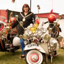 Rugby Mayor Maggie O'Rourke admiring two classic scooters