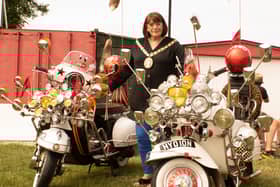 Rugby Mayor Maggie O'Rourke admiring two classic scooters