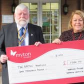 Rotary President Dick Dixon presents the cheque to Louise Careless at Myton.