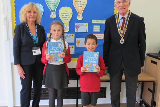 Rotary President Keith Talbot and Brenda Talbot with Coten End Primary school pupils. Photo supplied
