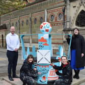 Tom Kittendorf, Rugby Borough Council chief officer for leisure and wellbeing, Pickle Illustration's Lauren and Liv, and Phoebe Hilton, Rugby Art Gallery and Museum's senior learning and engagement officer, at the new piece of public art now on display in the town centre.