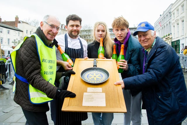 Warwick town centre, played host to the annual 'Pancake Race' this week.  With the winning adults race title being retained by 'The Globe'. Pictured: Keith Talbot (President of Warwick Rotary Club), The Globe team and John Parkinson (Rotary District Governor). Photo by Mike Baker