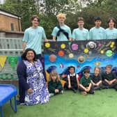 Rugby School volunteers with staff and pupils at Oakfield.