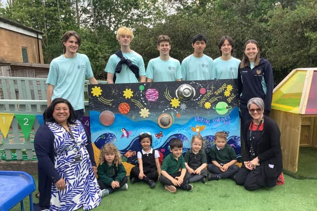 Rugby School volunteers with staff and pupils at Oakfield.