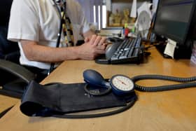 File photo dated 10/09/14 of a GP at their desk. GP appointments over the phone or online can miss serious illnesses and put patients at risk, according to a new study. Researchers said mistakes via remote consultation are rare, but there is a risk of patients being under-diagnosed, GPs being swayed by what has been said previously, and less qualified staff not acting on signs of illness. Issue date: Wednesday November 29, 2023.