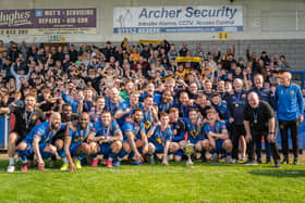 Leamington FC players, coaches, staff and fans celebrate their playoff final victory.