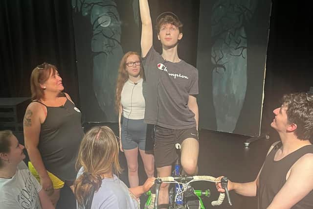 Performing arts students rehearse the musical.