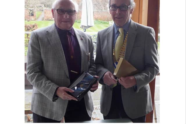 Chairman Brian Perkins presents Past Chairman Michael North with his past Chairman’s tie. Photo supplied