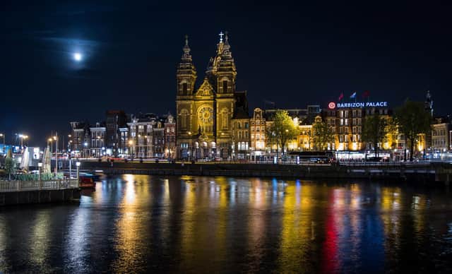 From centuries-old Dutch Baroque canal houses to Gothic Revival, the city’s filled with astounding buildings. Here's a view of Saint Nicholas Church at night. Picture: AURORE BELOT.