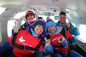 Daksha and Simon prepare to jump from the plane.